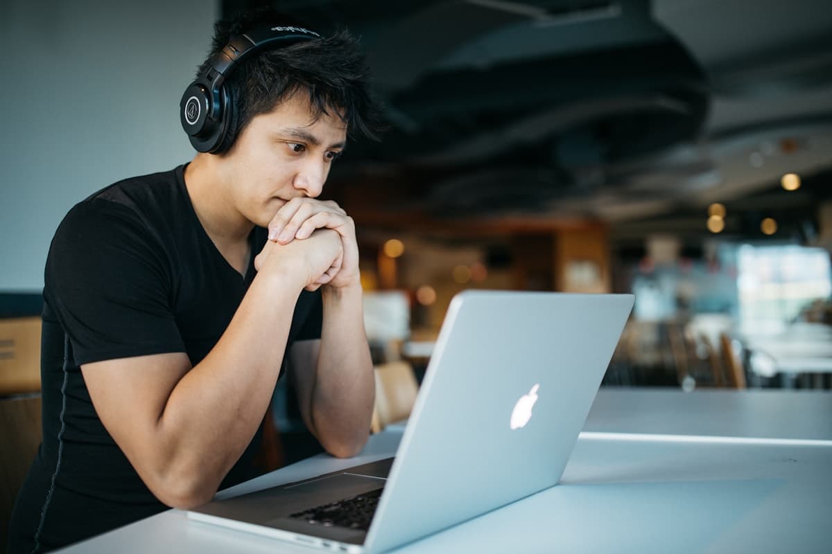 A student wearing headphones during a live online session.