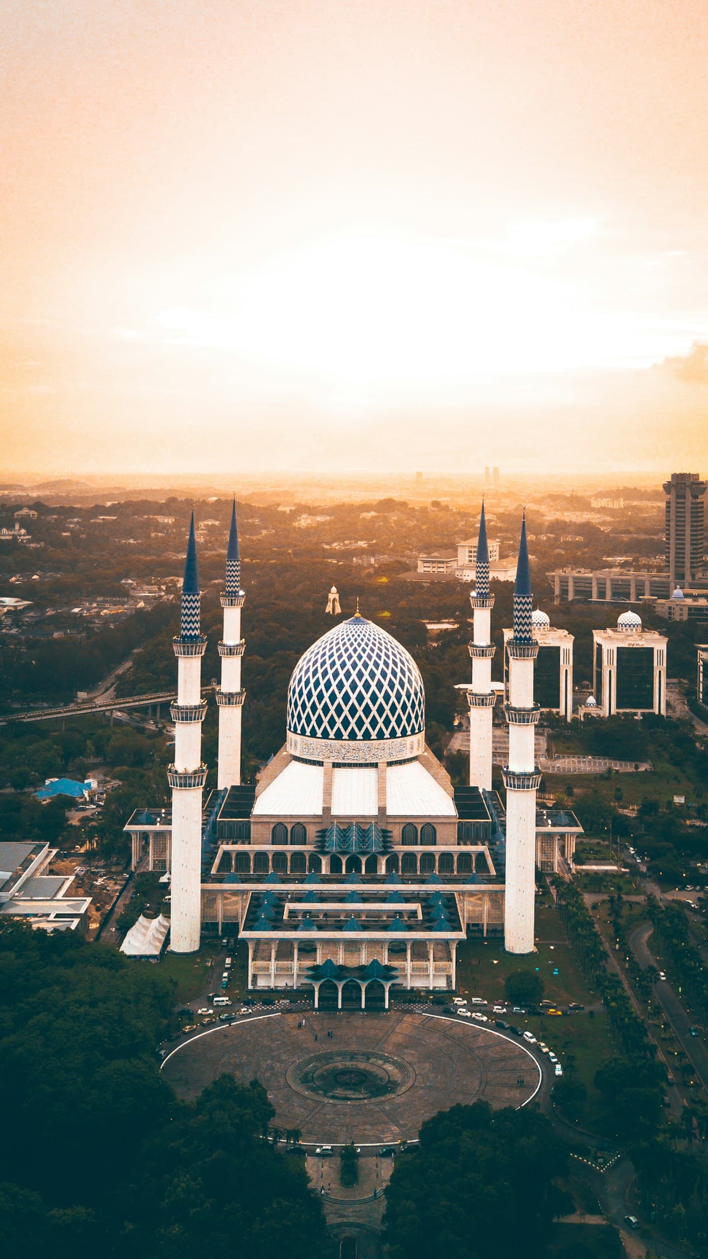 The Blue Mosque in Shah Alam under warm evening light.