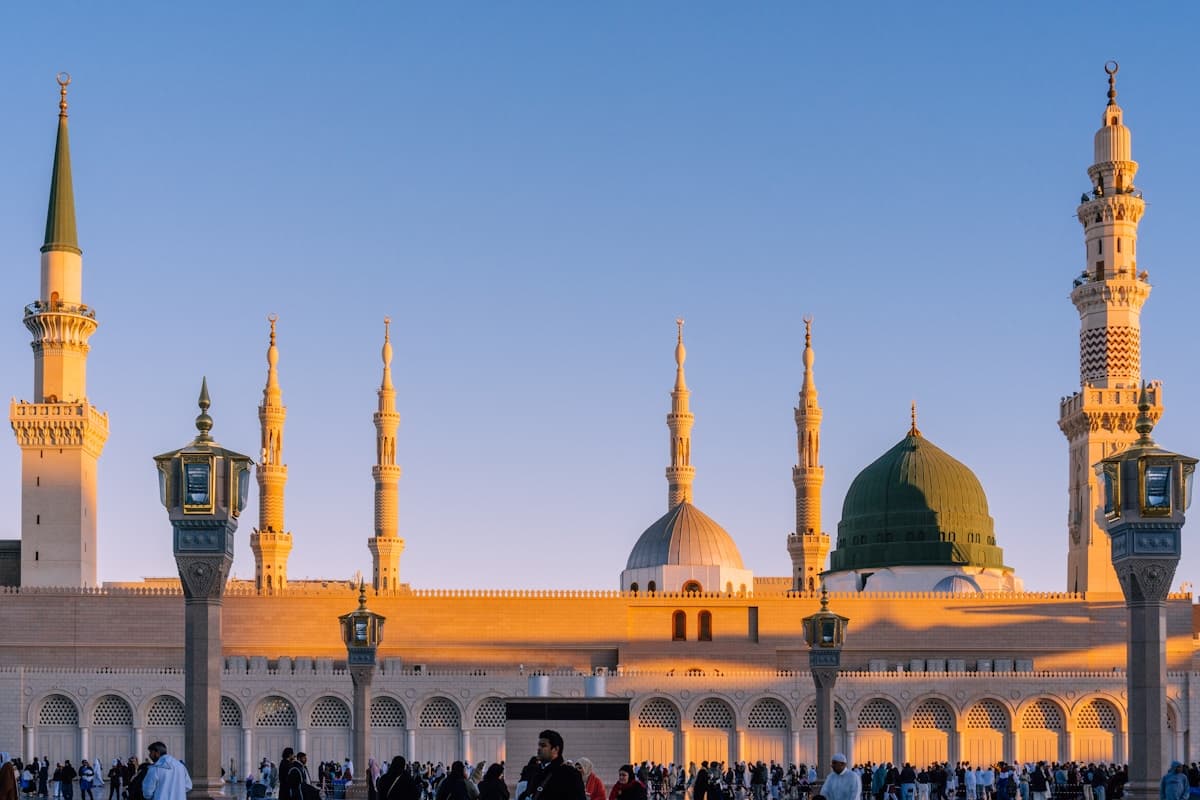 Al-Masjid an-Nabawi under warm evening light.